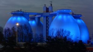 Image of egg-shaped anaerobic digesters at night.