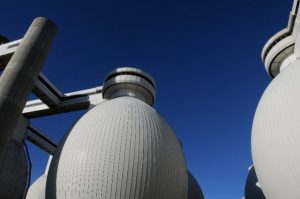Large conical digester tanks at a Wastewater Treatment Facility