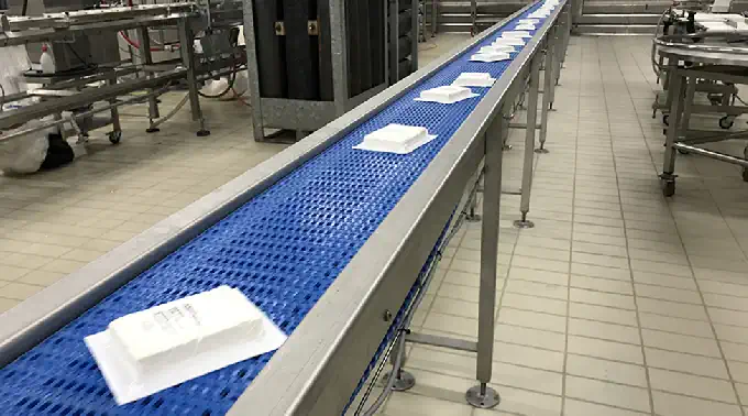 A flat belt conveyor for food industry use.