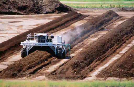 Machine Tilling Windrows of Composting Green Waste.