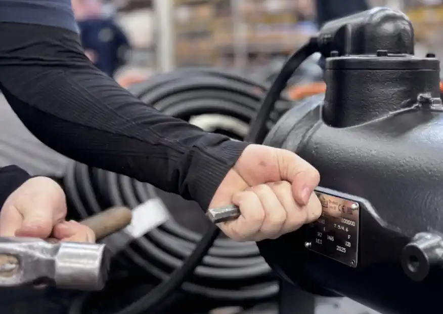 A historic glimpse during the plate fixing to Chopper Pump Serial number 100,000.